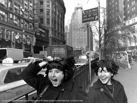 Two fans try out their Beatles wigs in anticipation of the British group's arrival in New York, 6 February 1964.