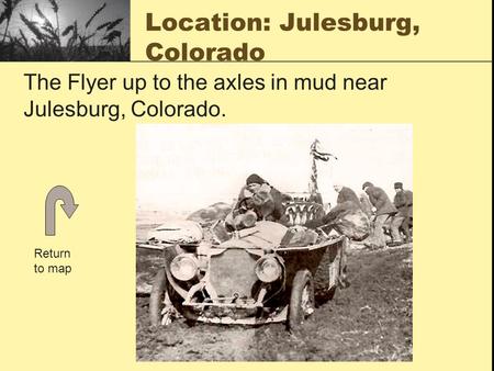 Location: Julesburg, Colorado The Flyer up to the axles in mud near Julesburg, Colorado. Return to map.
