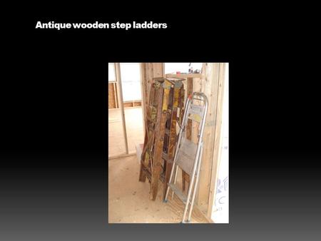 Antique wooden step ladders. The electrician has his name on everything including these folding chairs used for their lunches.