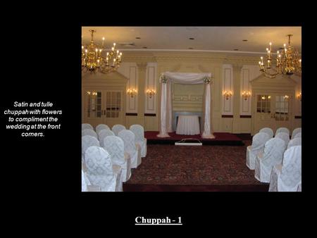 Satin and tulle chuppah with a garland of greens and flowers to compliment the wedding across the top and down the sides of the chuppah. Chuppah - 2.