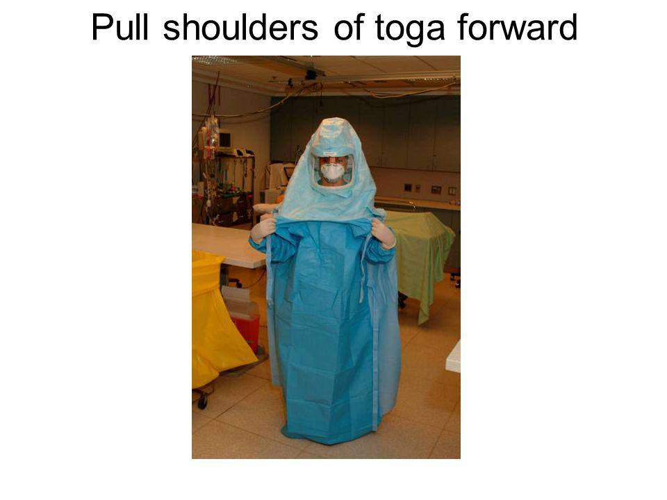 Pull shoulders of toga forward