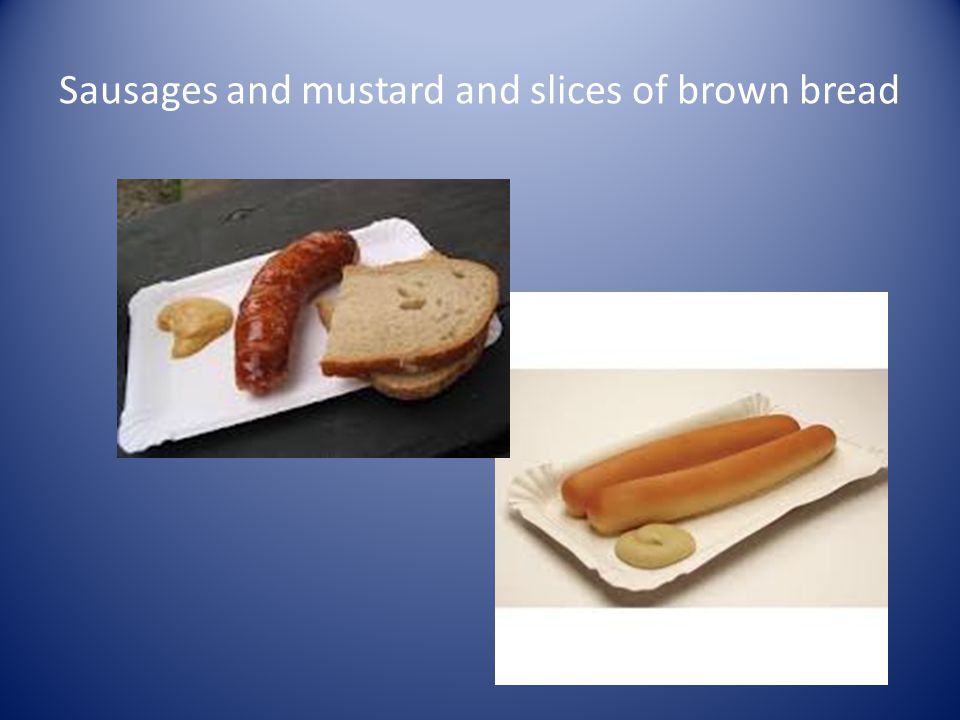 Sausages and mustard and slices of brown bread