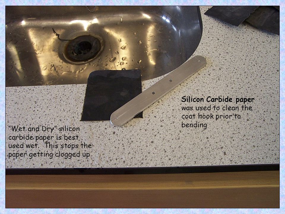 Silicon Carbide paper was used to clean the coat hook prior to bending