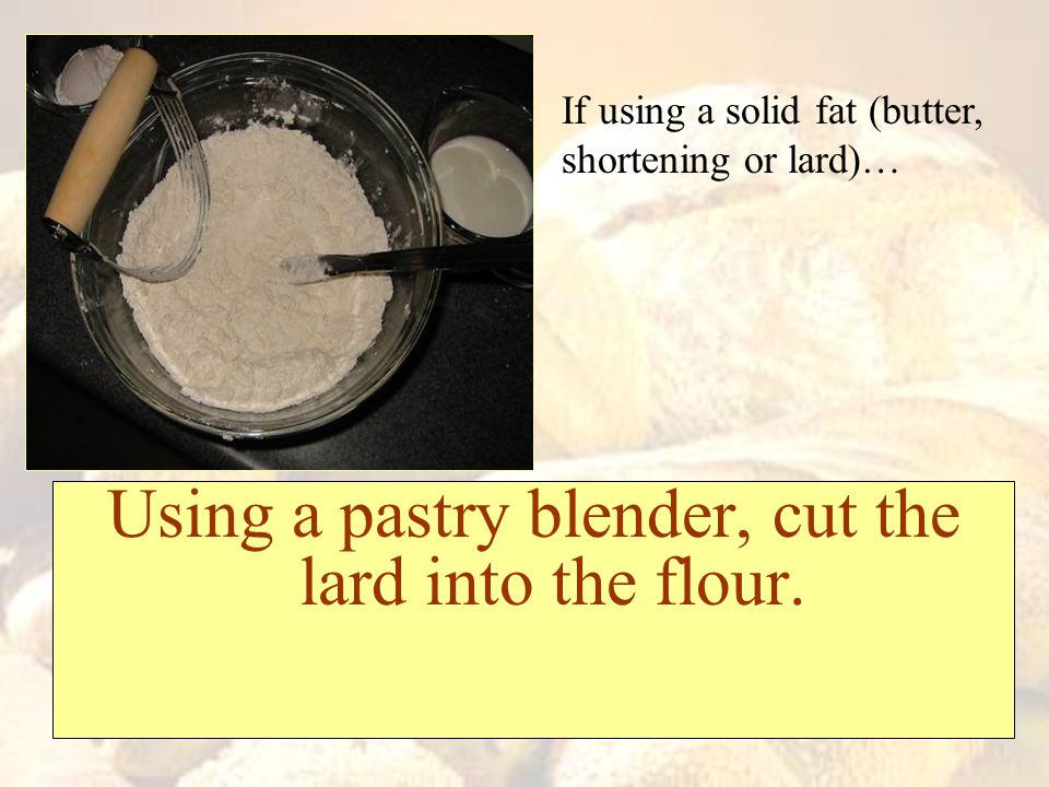 Using a pastry blender, cut the lard into the flour.