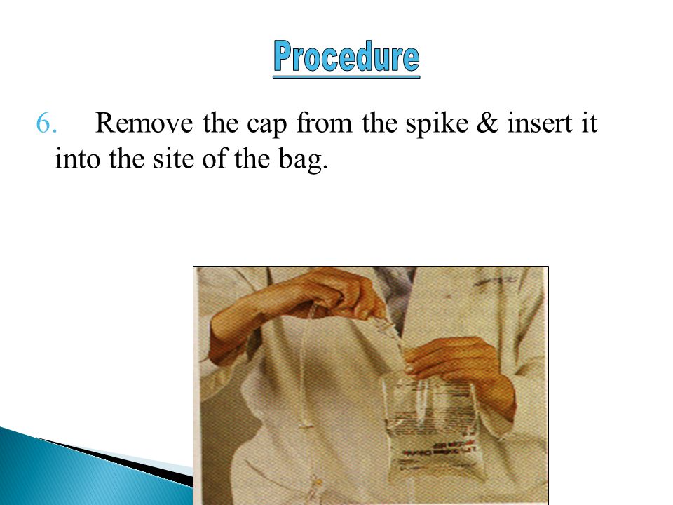 6. Remove the cap from the spike & insert it into the site of the bag.
