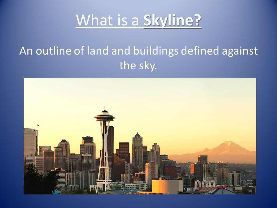An outline of land and buildings defined against the sky.
