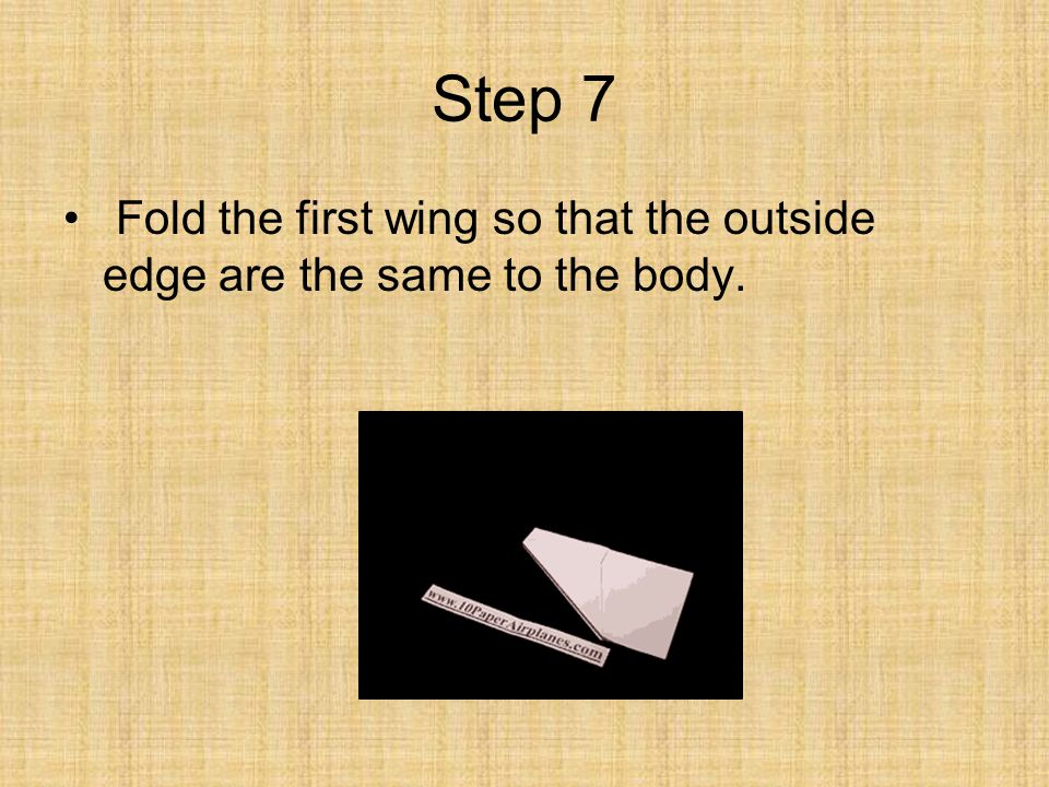 Step 7 Fold the first wing so that the outside edge are the same to the body.
