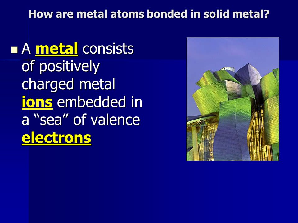 How are metal atoms bonded in solid metal