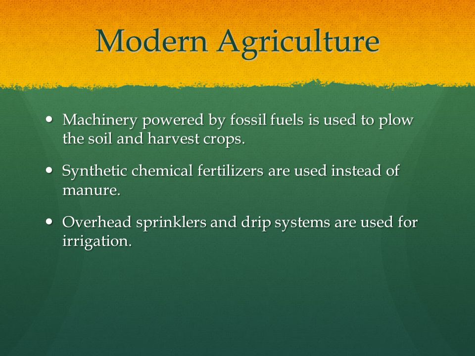 Modern Agriculture Machinery powered by fossil fuels is used to plow the soil and harvest crops.