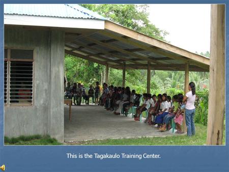 This is the Tagakaulo Training Center.. A literacy teacher hands out certificates.