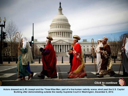 Actors dressed as (L-R) Joseph and the Three Wise Men, part of a live-human nativity scene, stroll past the U.S. Capitol Building after demonstrating.