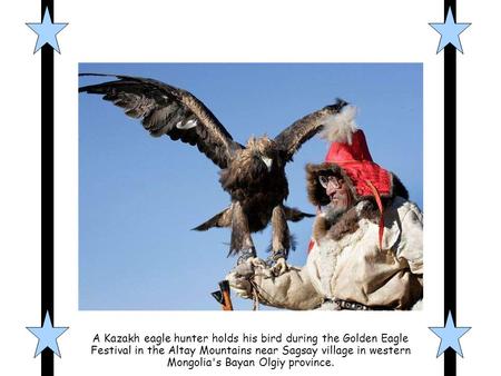 A Kazakh eagle hunter holds his bird during the Golden Eagle Festival in the Altay Mountains near Sagsay village in western Mongolia's Bayan Olgiy province.