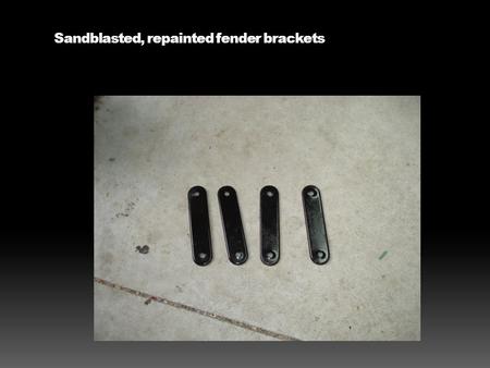 Sandblasted, repainted fender brackets. Mudflaps and rubber buttons to attach them.