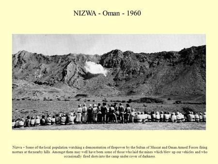 NIZWA - Oman - 1960 Nizwa – Some of the local population watching a demonstration of firepower by the Sultan of Muscat and Oman Armed Forces firing mortars.
