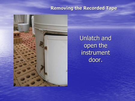 Unlatch and open the instrument door. Removing the Recorded Tape.