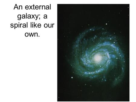 An external galaxy; a spiral like our own.. Which way does it rotate?