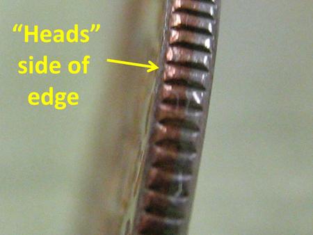 “Heads” side of edge. Diameter of human hair 5 meters.