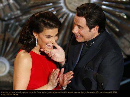 Idina Menzel and John Travolta present the Oscar for best original song at the 87th Academy Awards in Hollywood, California February 22, 2015. REUTERS/Mike.