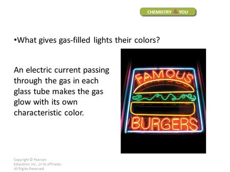 What gives gas-filled lights their colors?