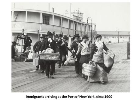 Immigrants arriving at the Port of New York, circa 1900.