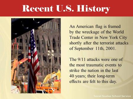 An American flag is framed by the wreckage of the World Trade Center in New York City shortly after the terrorist attacks of September 11th, 2001. The.