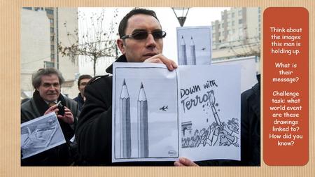 Think about the images this man is holding up. What is their message? Challenge task: what world event are these drawings linked to? How did you know?