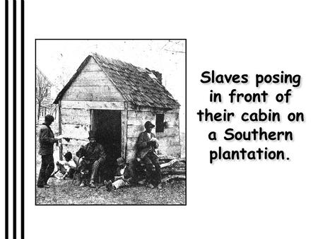 Slaves posing in front of their cabin on a Southern plantation.