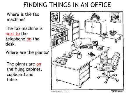 Where is the fax machine? The fax machine is next to the telephone on the desk. The plants are on the filing cabinet, cupboard and table. Where are the.