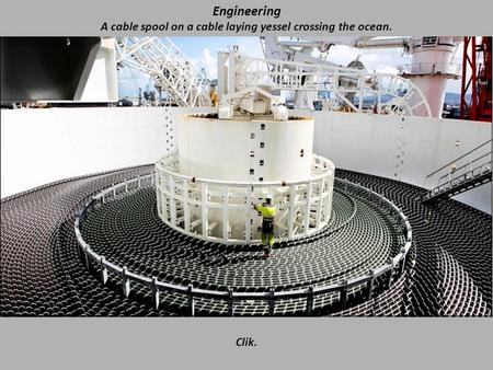 Engineering A cable spool on a cable laying yessel crossing the ocean. Clik.