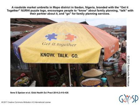 A roadside market umbrella in Mapo district in Ibadan, Nigeria, branded with the “Get it Together” NURHI puzzle logo, encourages people to “know” about.