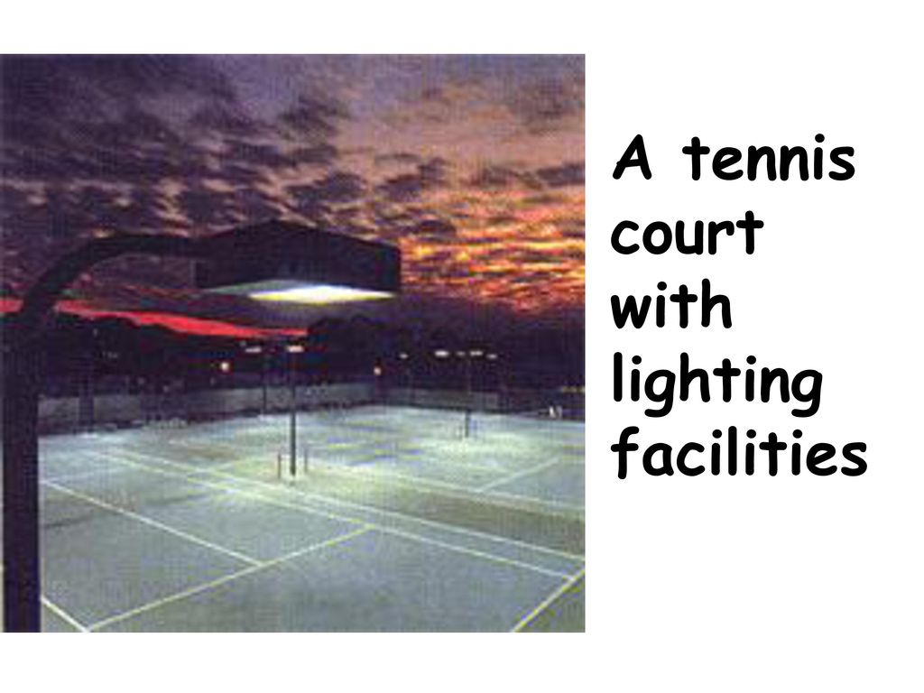 A tennis court with lighting facilities