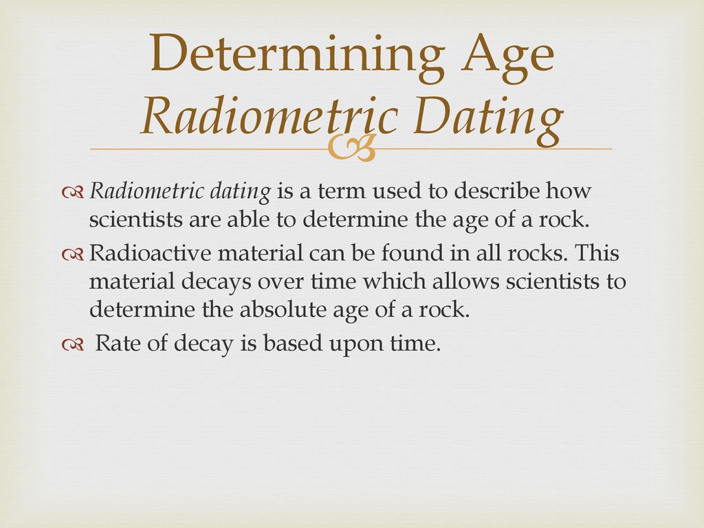 How do scientists determine the absolute age of a rock using radiometric dating