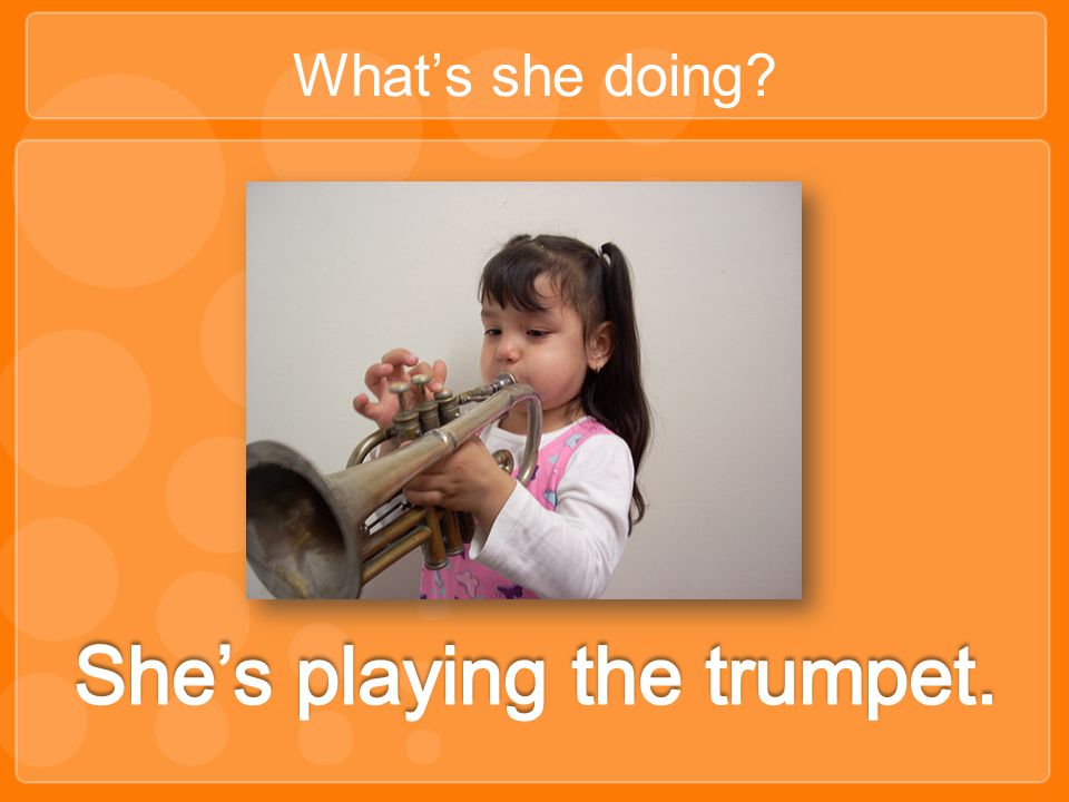 She’s playing the trumpet.