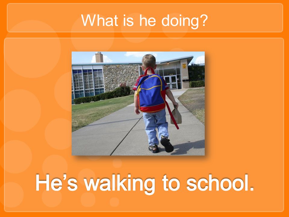 What is he doing He’s walking to school.