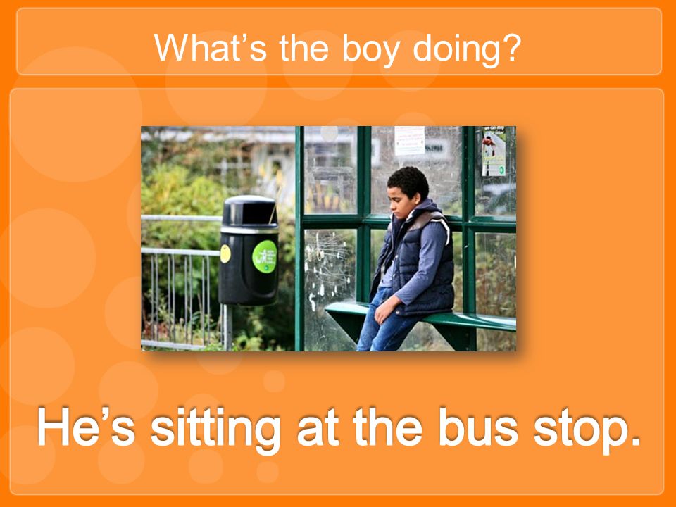 He’s sitting at the bus stop.