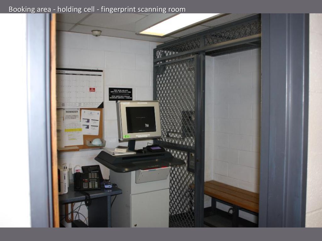 Booking area - holding cell - fingerprint scanning room