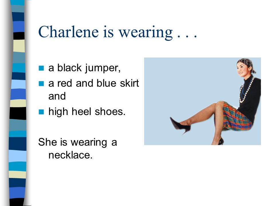 Charlene is wearing a black jumper, a red and blue skirt and