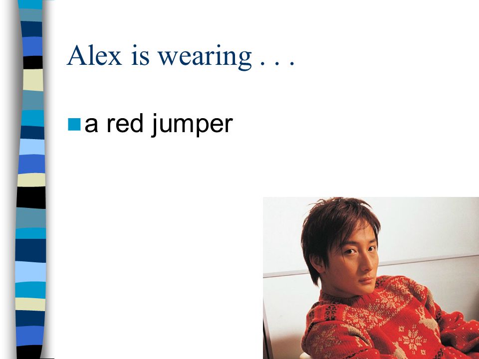 Alex is wearing a red jumper