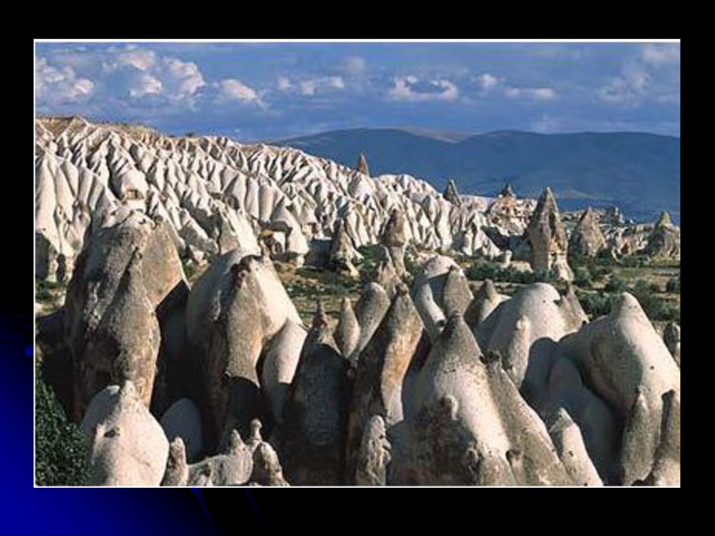 They are part of a volcanic landscape in Cappadocia, Turkey