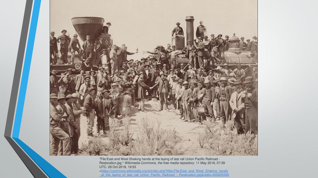 File:East and West Shaking hands at the laying of last rail Union Pacific Railroad - Restoration.jpg. Wikimedia Commons, the free media repository.