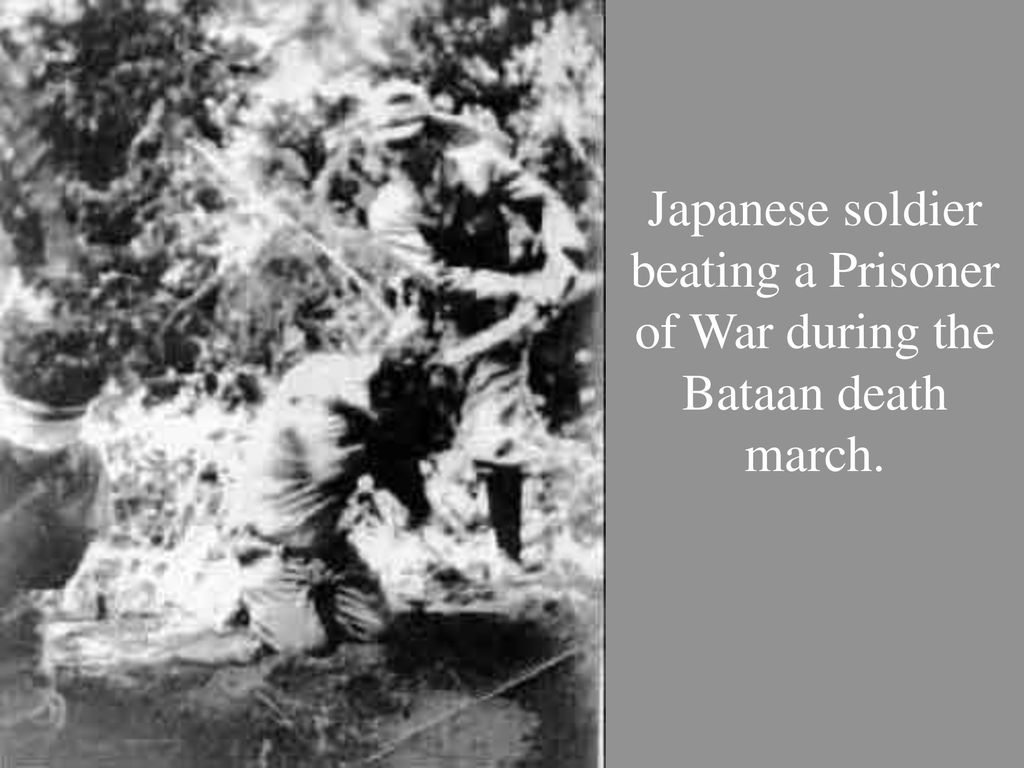 Japanese soldier beating a Prisoner of War during the Bataan death march.
