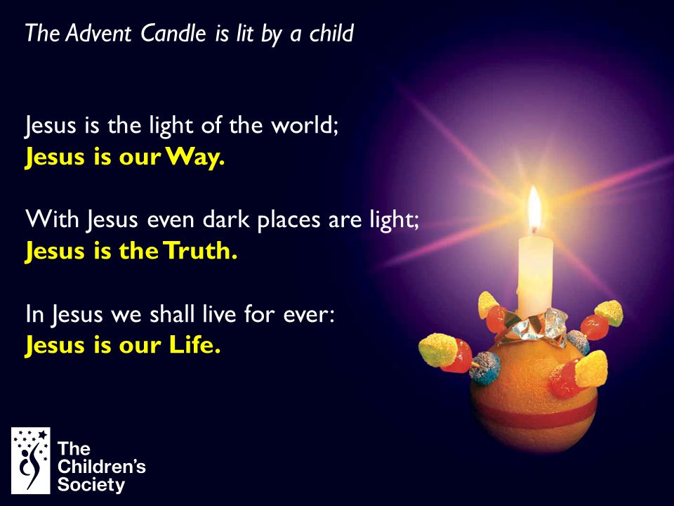 The Advent Candle is lit by a child