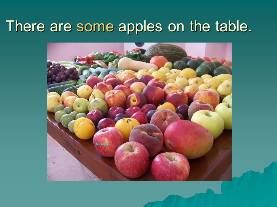 There are some apples on the table.