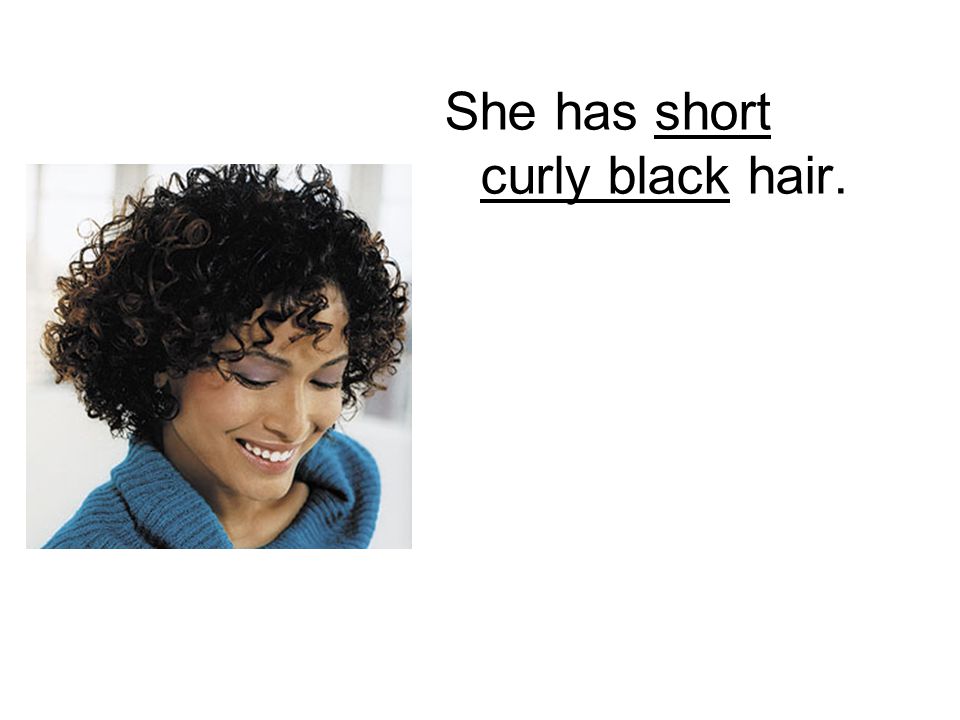 She has short curly black hair.