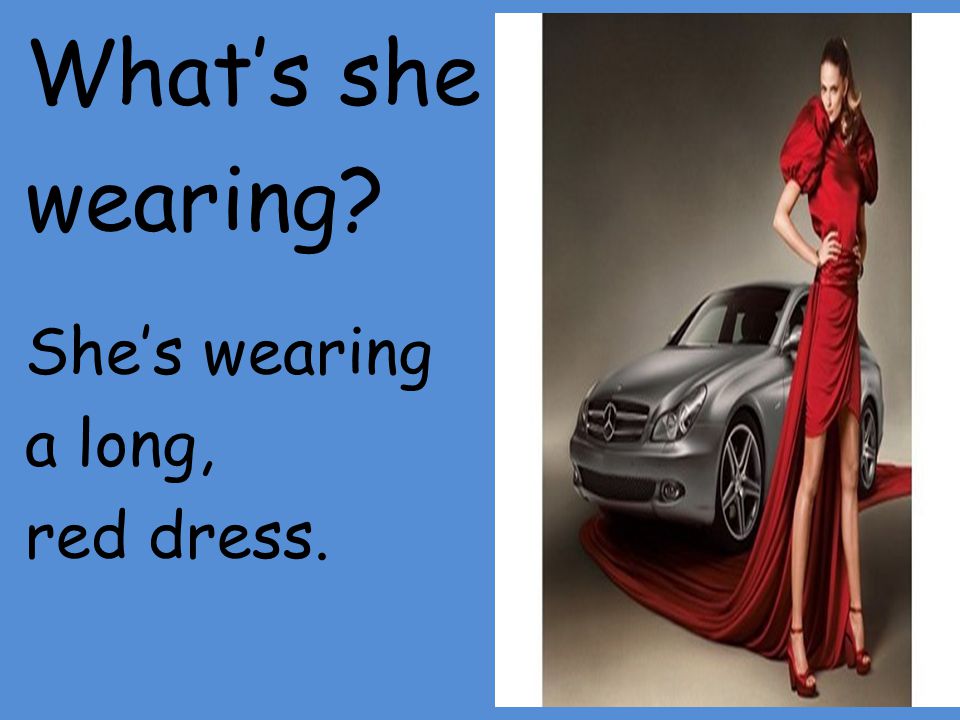 What’s she wearing She’s wearing a long, red dress.