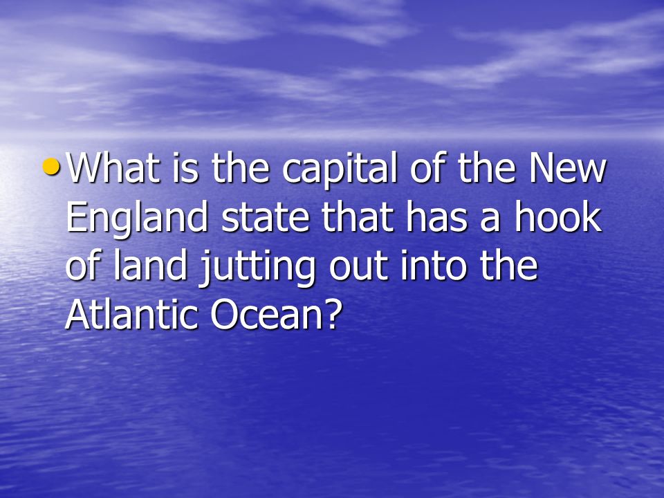 What is the capital of the New England state that has a hook of land jutting out into the Atlantic Ocean