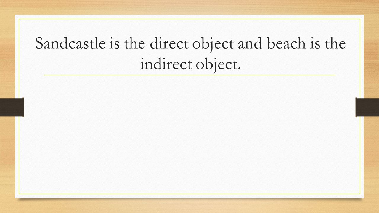 Sandcastle is the direct object and beach is the indirect object.